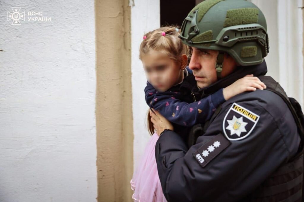 Police officers help civilians after Russian drone attack in Kharkiv